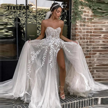 Прості сексуальні пляжні весільні сукні для нареченої елегантної мереживної весільної сукні без бретелей без рукавів