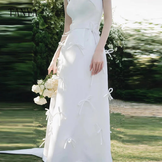 فستان زفاف رومانسي من الساتان مع أقواس تصميم جديد بأشرطة السباغيتي خط بدون أكمام ثوب زفاف رداء دي ماري
