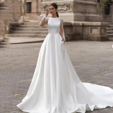 Boat neck long sleeves illusion back buttons embroidery lace A-line bridal gown 2026 – Pollyanna Events