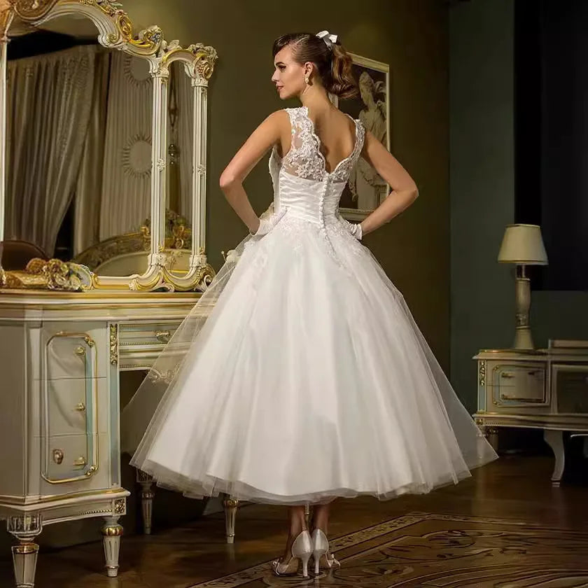 Classic short boat neck sleeveless buttons lace applique garden bridal gown wedding dress 2026 – Pollyanna Events
