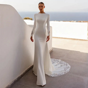 Luxury Mermaid Wedding Dress 2026 Boat Neck Long Sleeves Illusion Back Buttons Sequined Lace Applique Bride Bridal Gowns