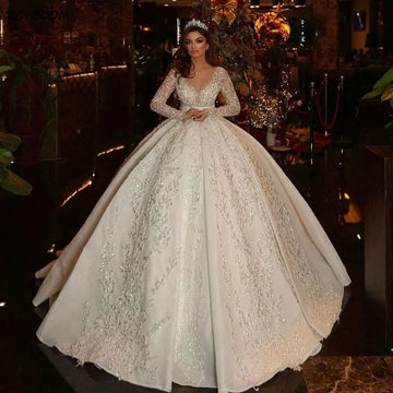 Saudi Arabic Ball Gown Illusion Back Long Sleeve Wedding Dresses 2024 Princess Sweetheart Glitter Sequined Appliques Bride Gowns champagne