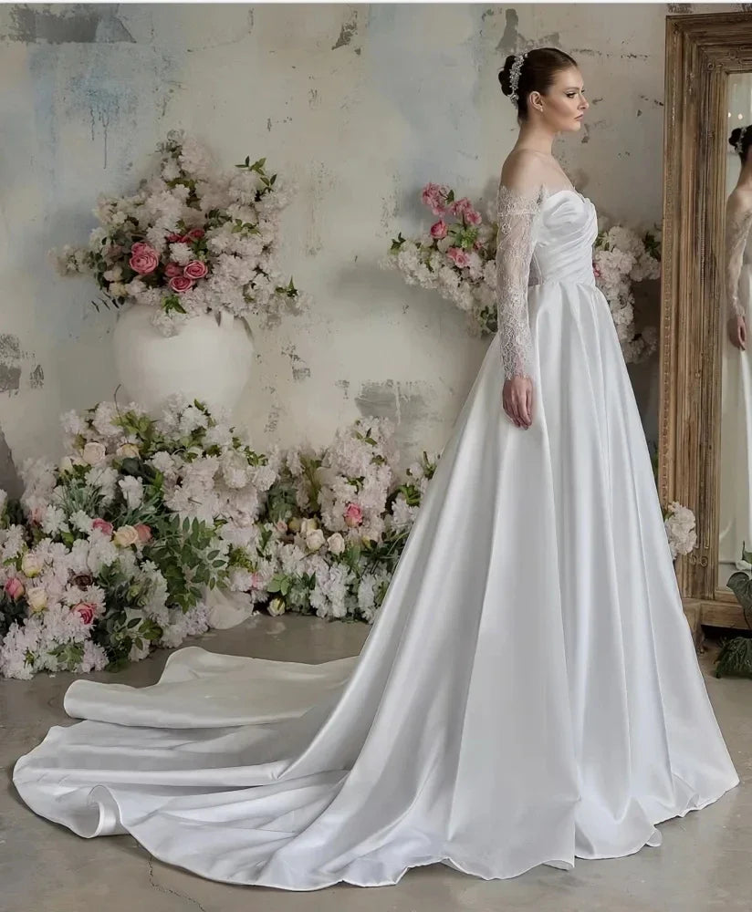 Elegant sheer neck lace long sleeves satin church bridal gown wedding dress 2026 – Pollyanna Events